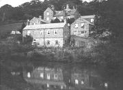 Our Archivist, Hugh Potter, says of this picture: "This image is a really exciting find, as it is a very sharp copy of an old print of Robin Hood, the hamlet between Whatstandwell and Gregory Tunnel. The site was a stone saw mills, built there presumably because of its proximity to Duke's Quarries (which supplied gritstone for the construction of several well-known buildings in London) and the water power offered by the stream which runs through the hamlet before passing under the canal by a deep culvert. On a map of 1811, a Stone Wharf is shown, but no buildings. The original cast iron windows can be seen on the lower floor of the main building to the left. A steam engine was once installed here, but is thought never to have operated, possibly because of the stone traffic transferring from canal to railway. The canal is narrower now than it was, and the workshop to right that is no longer there."