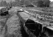 A view from the towpath - the railway bridge is the girder in the middle distance