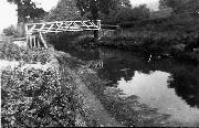 This picture shows the original (wooden) Bridge 35 at Golden Valley. It was replaced (we think in the late 1940's) by the present structure, which carried the water supply into the hamlet. This was still connected as late as 1979, when works to restore the section broke it, causing a mild flood one Sunday morning