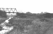 By 1964 the Forge buildings had gone and the bridge presided over the derelict entrance to the Portland Arm. Note that one of the top members appears to have been cut through.