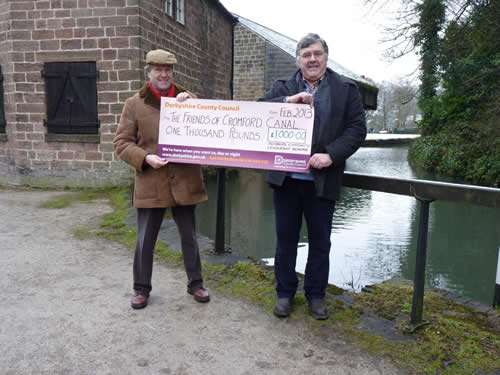 Cllr Purdy hands over a cheque for £1000 to the FCC Chairman, Pat Morriss