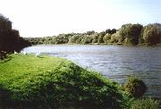 This is the Codnor Park Reservoir, which had its water level lowered and spillways installed at both ends in 1985 as part of a flood prevention scheme which also eliminated Ironville Top Lock. The canal ran through the trees on the left of the photo, with the towpath between the canal and reservoir.