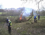 ... feeding a bonfire at the other end of the section.