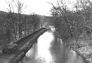 East of the Iron Aqueduct - This restored section has been breached several times since original construction. Notice the piles driven in down the left hand side of the canal. This picture was taken with the water almost at the point of overtopping.