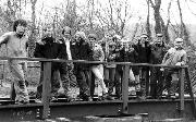 PHASE ONE - the main steel assembly - is completed in a day. 10 men and a girl pause for a group photo.