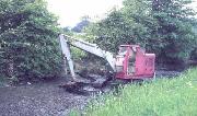 The 9 ton Smith 14 excavator having just arrived. It was driven across the fields above the canal and into the canal bed through the entry point just visible behind the machine. (ADS)