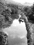 The floating dredger clearing the Gregory Dam on it's way to Leashaw.