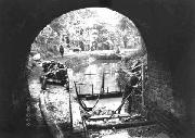 Looking west out of the Gregory Tunnel. No stop plank groves were ever installed here, and we thought it expedient to do so. Behind can be seen a wriggly tin dam, with the dredger floating on the water retained.