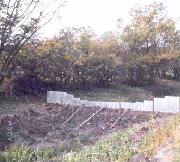 The wriggly tin dam immediately west of Bridge 1. This retained water successfully in the Cromford Wharf and the first 250 yards of canal, while we went through Bridge 1 with the digger. After that the stop planks were inserted under the bridge. (ADS)