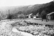 From High Peak, looking east. This shows how it was found when the Smith 14 excavator got there. We had de-watered this section some time before, hence the luxuriant weeds. c.1974. (B&W from ADS transparency.)