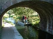 The work boat passes under the Lawn Bridge