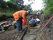 A rare picture of me actually working(!) as we start to lay the concrete base for the first stage of stonework 