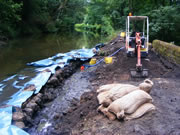 Once the flow of water is stopped, the old structure can then be removed - using a combination of mini excavator and hand tools. Photo: Squidge Scicluna