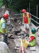 Stonework continues - with yet another conference on which is the right piece of stone for the job! Photo: George Rogers