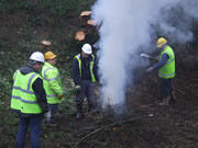 It takes many volunteers to keep a satisfactory fire going! Photo: George Rogers